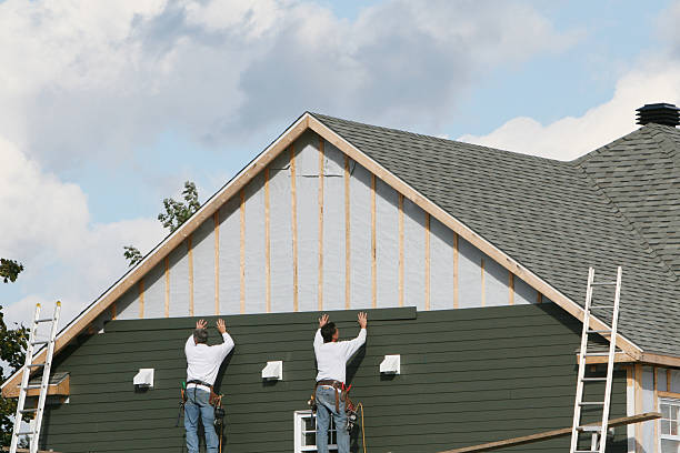 Professional Siding Contractor technician working in Reading, MA